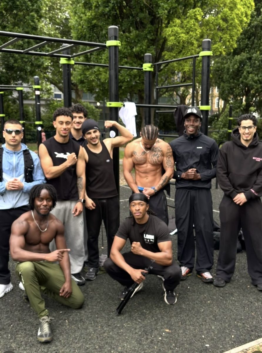 Tyrese with a group of friends at an outdoor calisthenics park